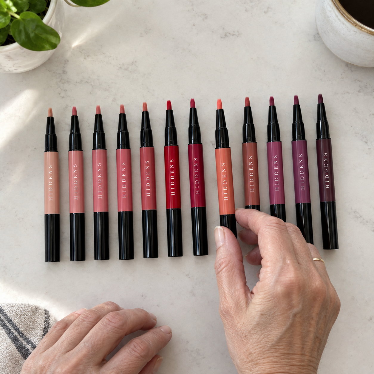 All 36 shades of the Signature Pen laid out in a fan